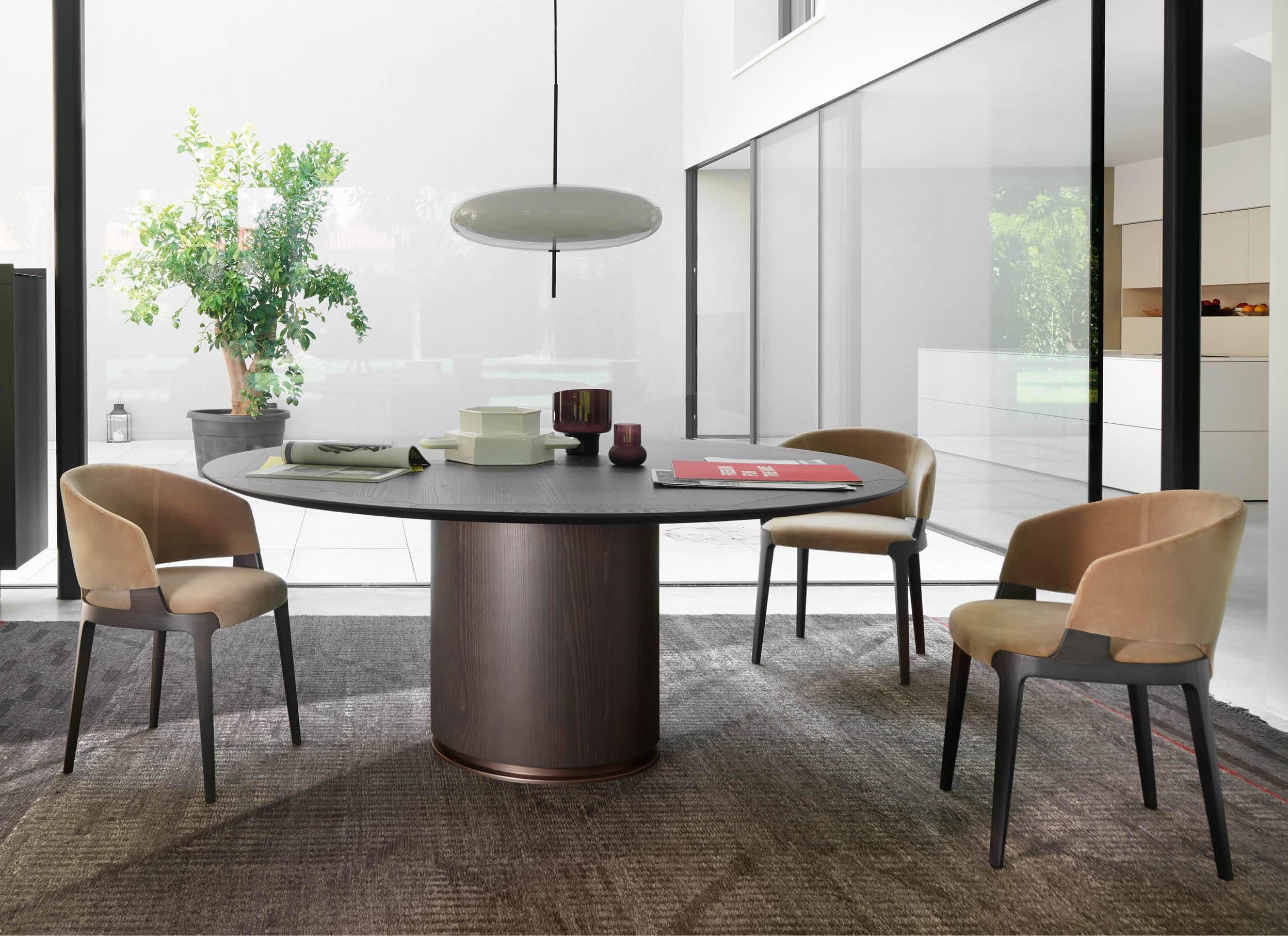 Round dining table discount with tub chairs